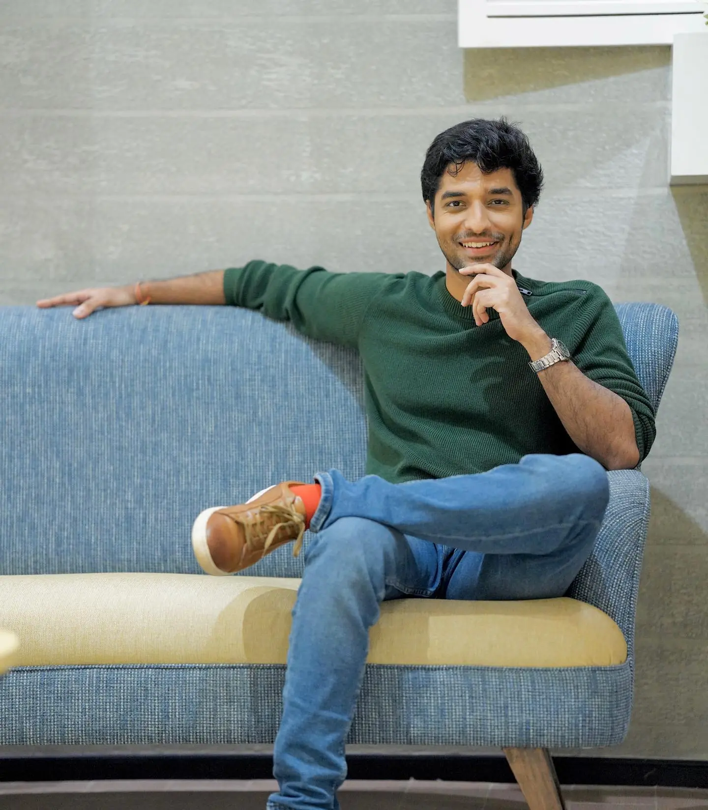 A man sitting at home, considering his health cover