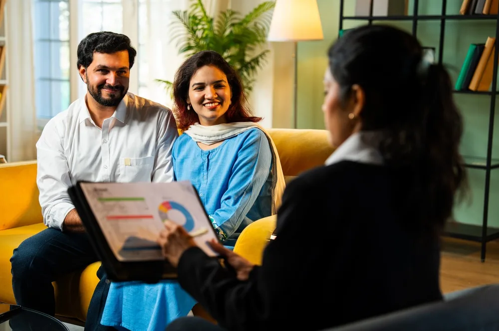 A couple reviewing a term cover illustration with a Pillow advisor